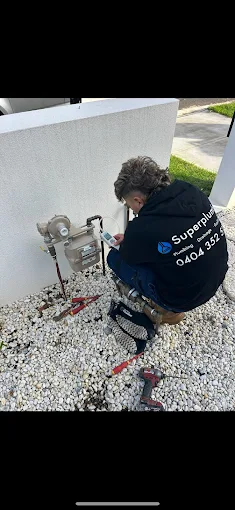 Superplumb plumber servicing gas equipment