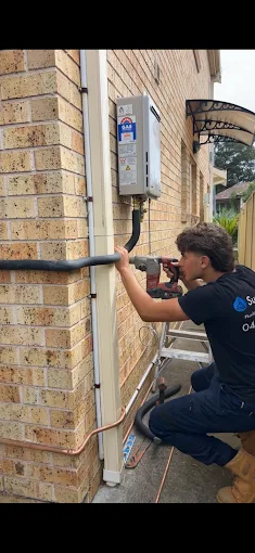 Superplumb plumber completing an installation