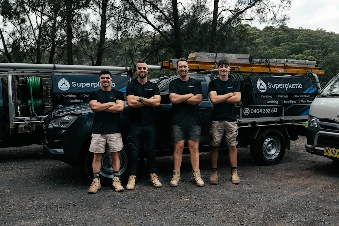 Superplumb team and service vehicles