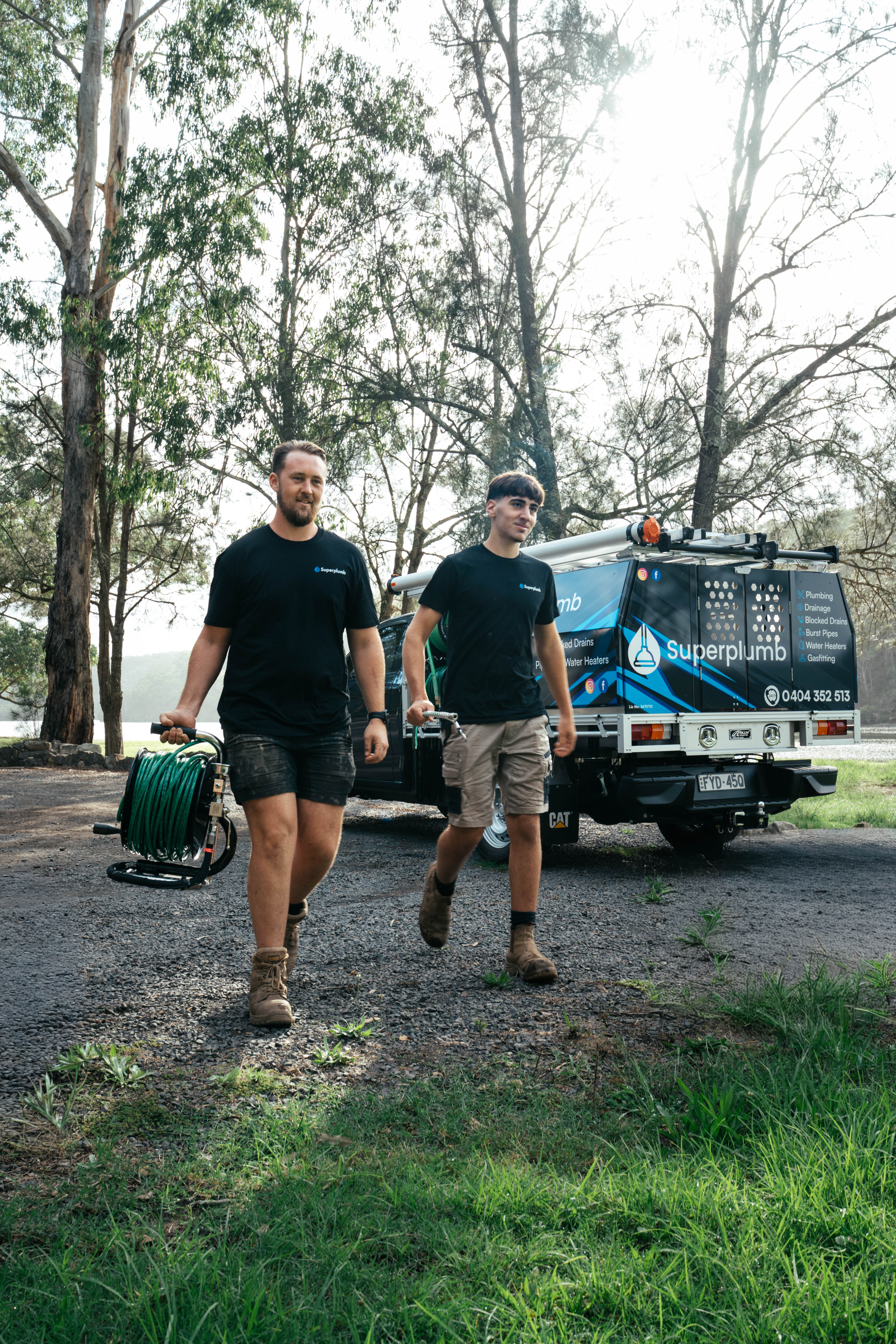 Superplumb plumbers arriving with professional drain-cleaning equipment